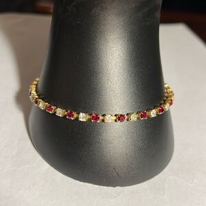 Ladies 8” faux Ruby/Diamond tennis bracelet.